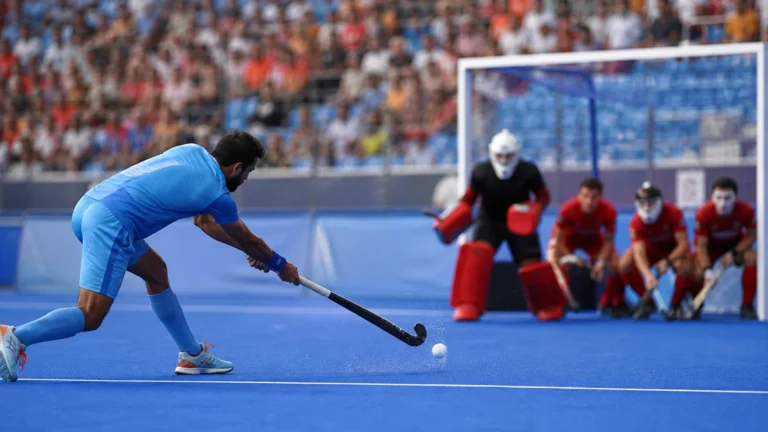Indian field hockey player taking a penalty corner against Wales in an editorial illustration